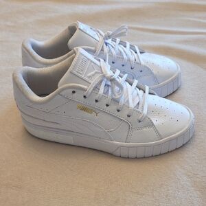 Immaculate Puma Women's White Sneakers with Gold Accent, Size 7.5